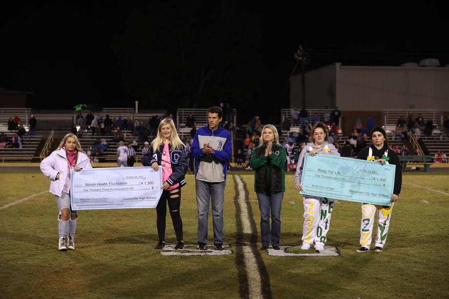 During the Cherryville High School and Bessemer City High School “pink out” football game, the schools raised money for two non-profit organizations. Bessemer City High School donated $1,000 to Relay for Life and Cherryville High School donated $1,300 to the Atrium Health Foundation.